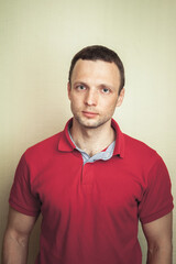 Obraz premium Studio portrait of young European man in red