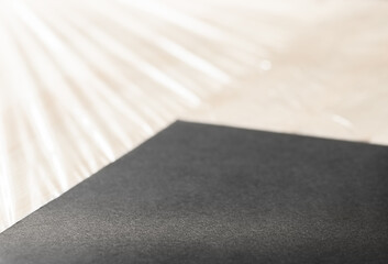 Blank black desk mat on work table mockup, side view. Empty fabric pad for mouse and keypad control