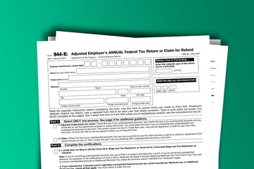 Naklejka premium Form 944-X documentation published IRS USA 03.29.2021. American tax document on colored