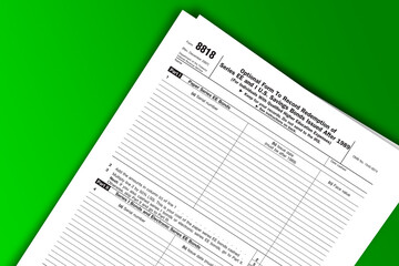 Obraz premium Form 8818 documentation published IRS USA 07.17.2012. American tax document on colored