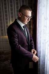 Portrait of a young male businessman. Groom on the wedding day. Wearing a business suit for an important interview.