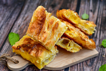 Fresh baked home made  Cheese Puff pastries.Cheese pie with phyllo pastry and  white cheese.