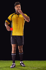 Youre off. Shot of a referee against a black background.