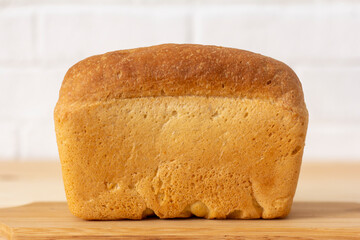 A loaf of wheat bread on the table.