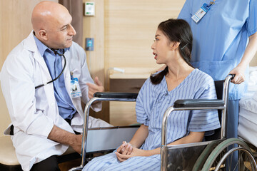 A doctor listening to a patient's heart is sitting on a viewshare.