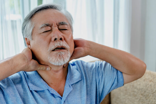 Older asian man shoulder pain.