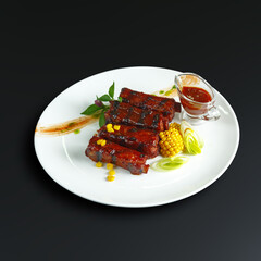traditional dishes of European cuisine, delicacy, banquet snack. culinary dishes on a white plate on a black background. restaurant service