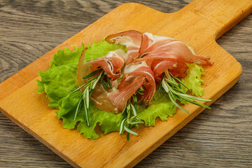 Sliced pork Jamon with rosemary
