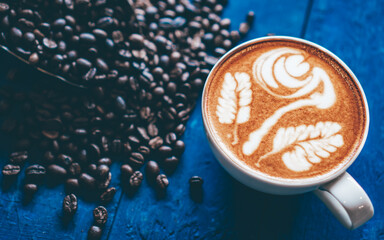 coffee latte art on wood table, relax time, cafe barista art top view.