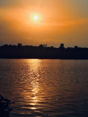 Naklejka premium sunset over the river