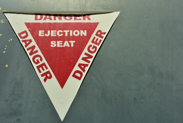 A warning sticker on an old war plane