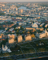 Fototapeta na wymiar Summer shot from above of Kazan city. Capital of the Tatarstan, Russia. City centre and landmark. Buildings and attractions. Torism and tourist destination. Farmer's palace and Kazan Cathedral
