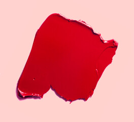 Lipstick balm red lip gloss swatch isolated on beige background - obrazy, fototapety, plakaty