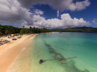 a tropical island with a snow-white beach and a turquoise sea in the Dominican Republic filmed from...