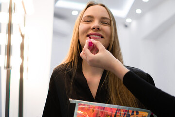 Portrait of beautiful woman getting cosmetic care at beauty salon