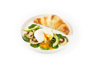 Fresh croissant and ingredients or salad egg, spinach, mushrooms on the plate on white background 