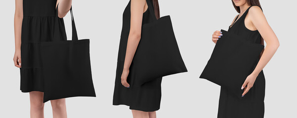 Mockup of a black totebag on the shoulder of a girl in a sundress, isolated on background.