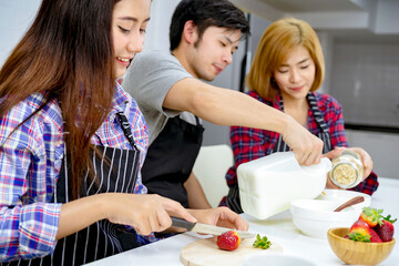 asian family enjoy party cooking together holiday in kitchen.
