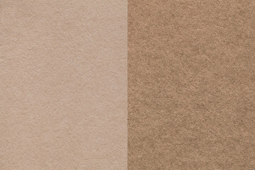 Texture of craft beige and brown paper background, half two colors, macro. Structure of vintage...