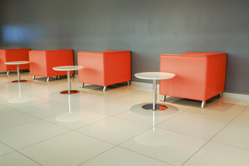 Plaster wall chairs arranged with rows of tables. Use it as a background for various scenes.