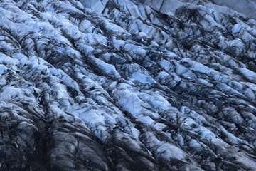 close up of vatnajökull glacier (Skaftafelljökull) in south iceland, beautiful blue ice covered partly with volcanic ash