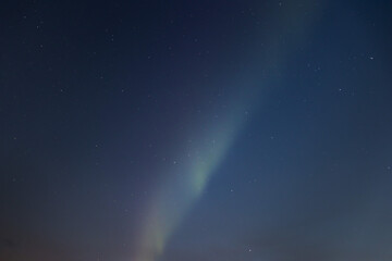 beautiful aurora borealis on the blue night sky