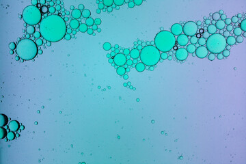 Cosmetic liquid texture with oil drops. Toner. Extract. Serum. Blue bi-phase cleanser.