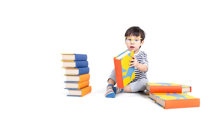 little boy wearing glasses with books on white background, education concept.