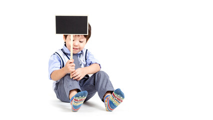 little boy holding a sign on white background.