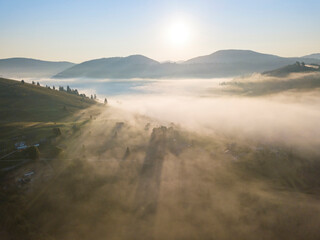 Morning fog in the Ukrainian Carpathians. Aerial drone view.