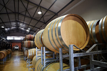 The factory floor. Wine barrels inside a factory.