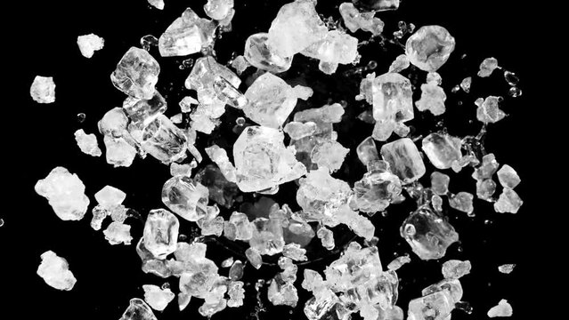 Super slow motion of rotating crushed ice on black background. Filmed on high speed cinema camera, 1000 fps.
