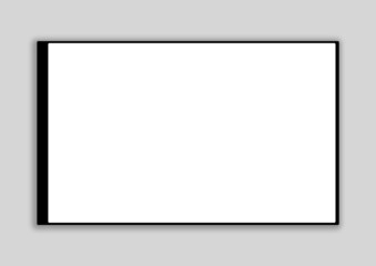 a black tablet, a device for communicating with a white blank screen. on a light gray background. copyspace
