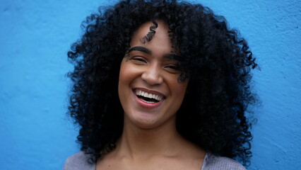 A happy latin African woman laughing and smiling