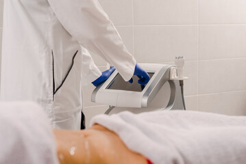 Closeup photo of woman getting body contouring procedure in beauty clinic © Denys Kurbatov