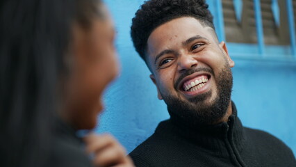 A black man portrait talking to friend face close-up