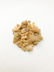 Natural incense, frankincense resin and dammar close-up on a white background, place for text.