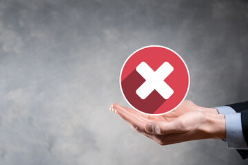 Hand holds icon,cancellation symbol,cancel icon.Cross mark flat red icon.round X mark.cancel...