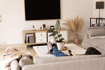 person watching tv in room