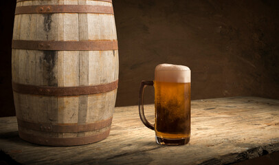 pouring beer with chicken wings in background.
