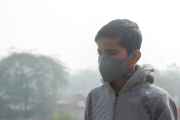 Boy wearing protection mask, India