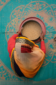 Indian women cleaning food grains