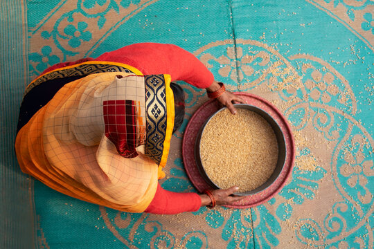 Indian women cleaning food grains