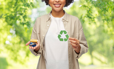 eco living, environment and sustainability concept - portrait of happy smiling woman holding green...