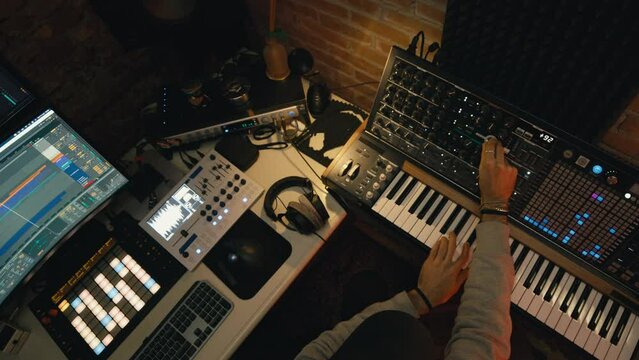 Dj producer is mixing a new music track