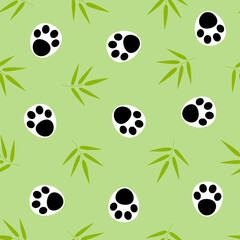 Bamboo twigs and panda paws on a green background seamless pattern.
