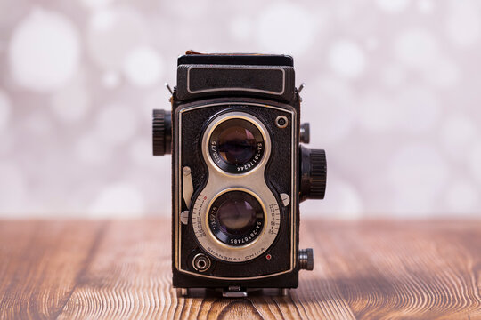 Retro camera on a wooden table