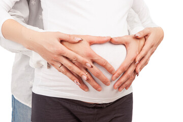 Fototapeta na wymiar Closeup of Hands of Caucasian Couple Over Pregnant Womn Belly Over White Background