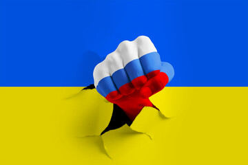 Russian invasion of Ukraine. Man breaking through paper Ukrainian flag with fist painted in colors...