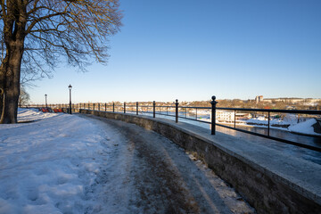 Fototapeta na wymiar Narva. Estonia. March 10, 2022 . Embankment in the city view of the river and the opposite bank